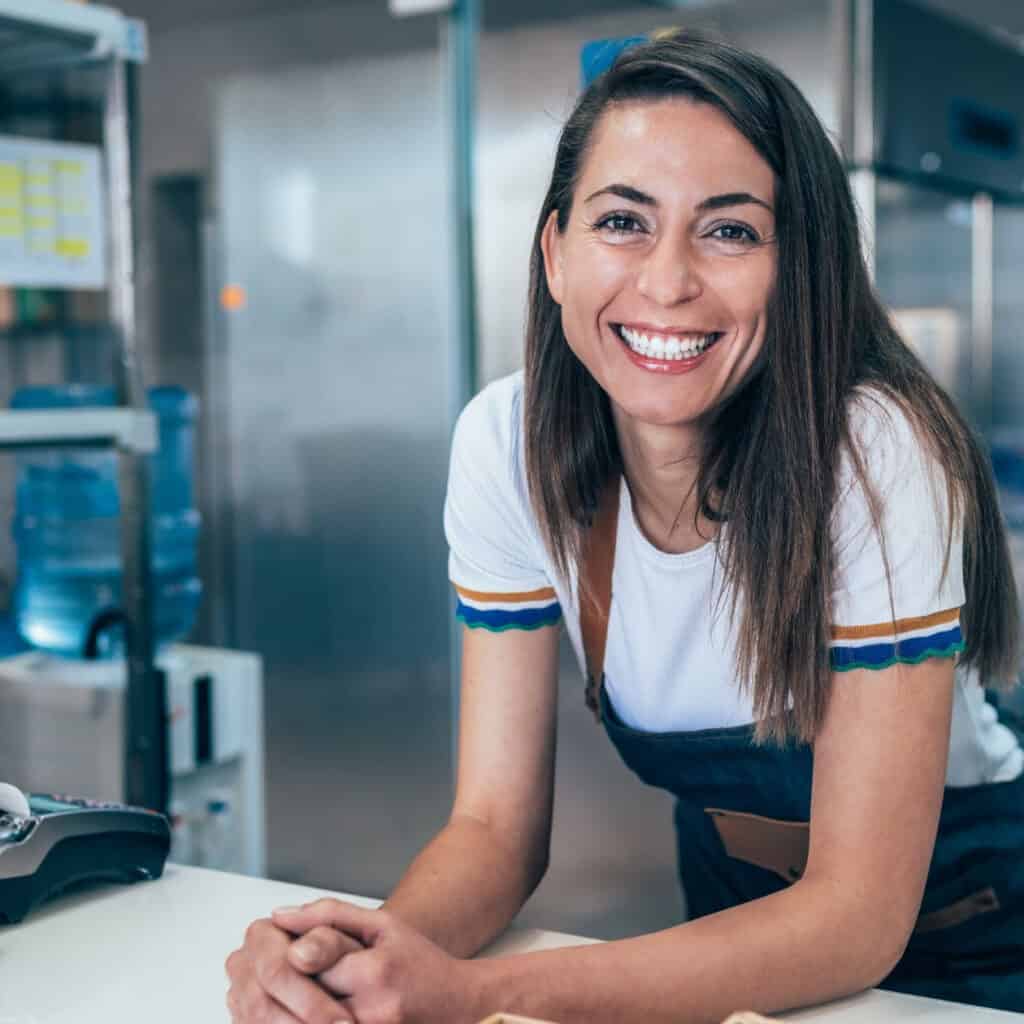 Female smiling at desk